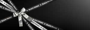 Dark ribbons decorated with Black Friday text