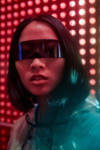 Portrait of young Asian woman wearing cyberpunk glasses